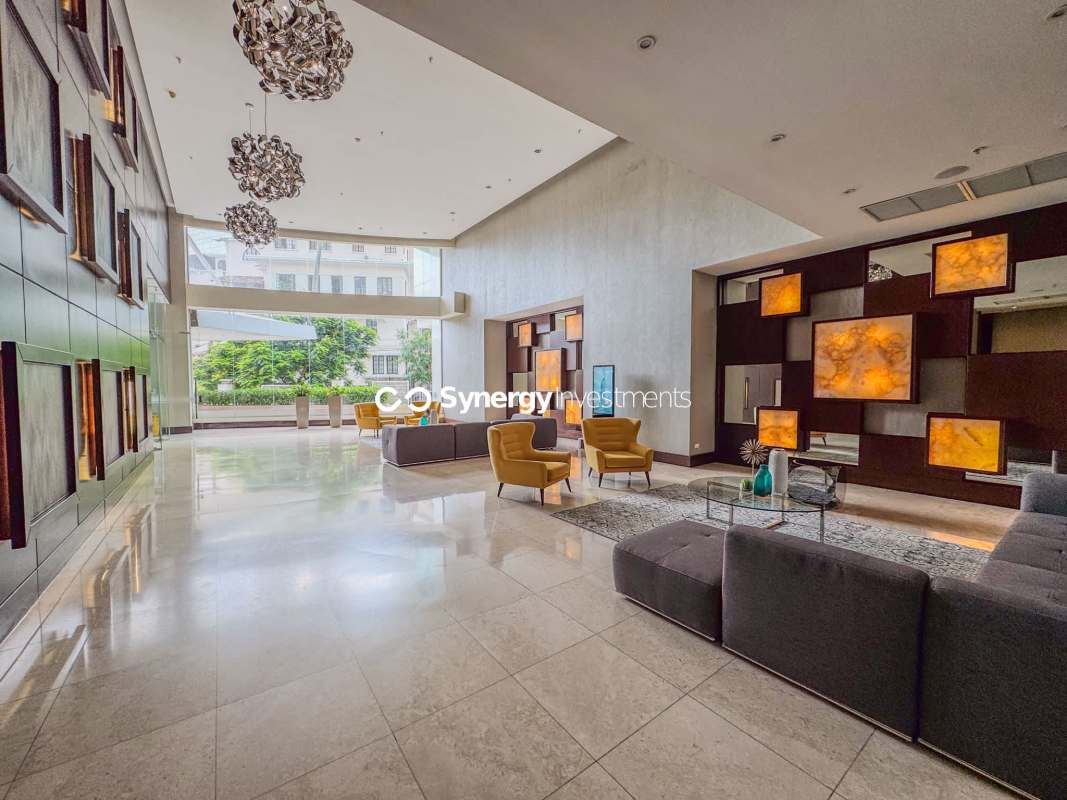 Large living room with ceramic floors, glass access to balcony in PH Terrawind Bella Vista