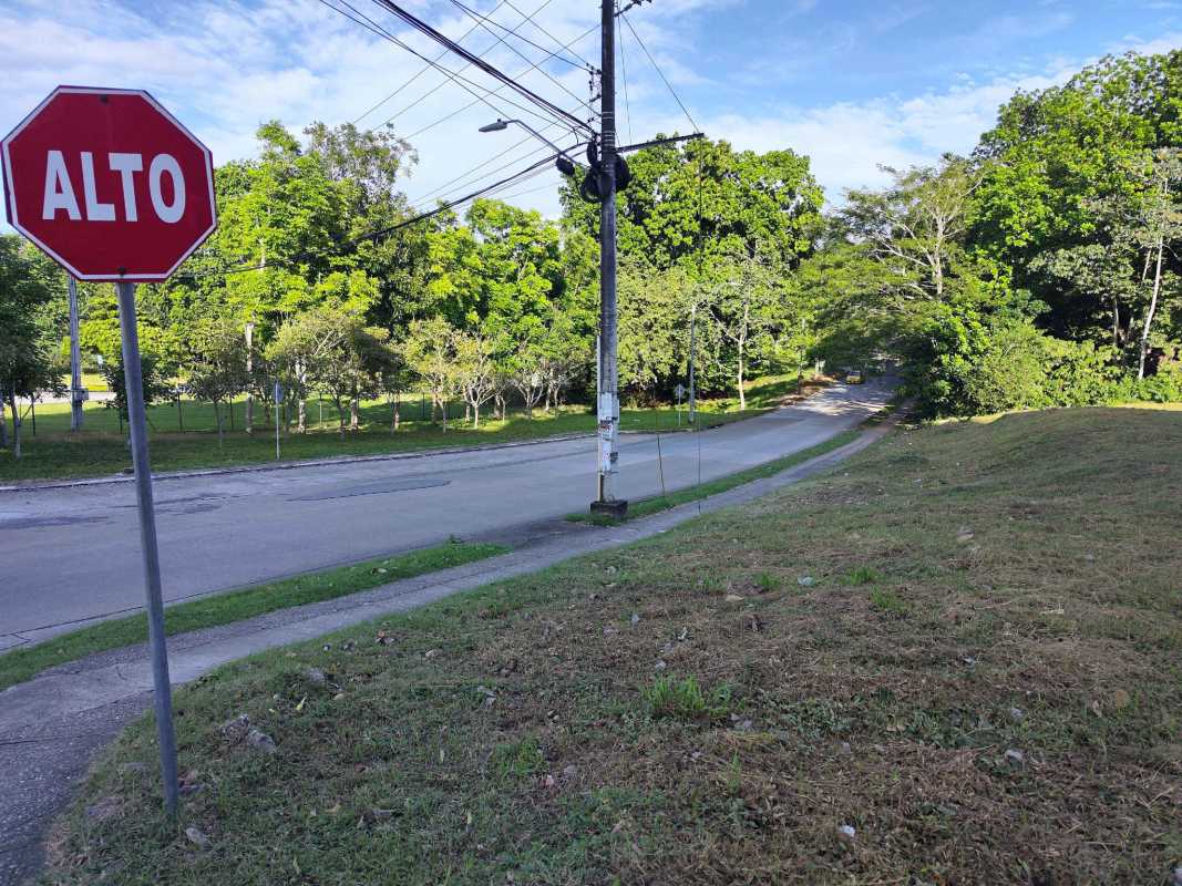 View of corner vacant land along paved roads in Albrook Panama, ideal for residential or commercial build.