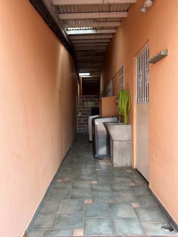 Laundry area with washing machine sink outdoor access house Bariloche Altos de Panama