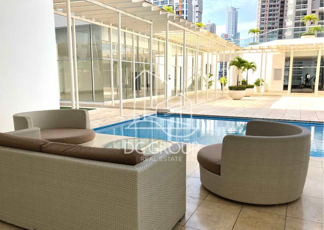 Furnished bedroom with floor-to-ceiling city view windows in Costa del Este Panama rental apartment
