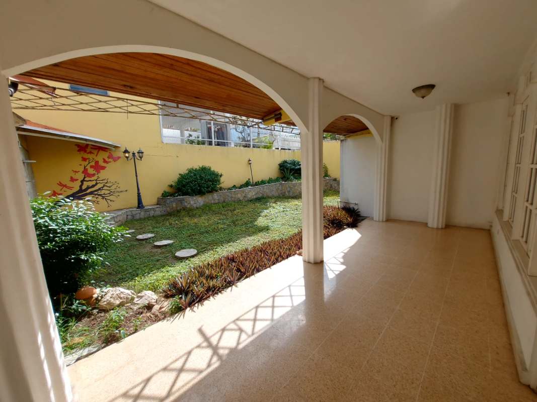 Kitchen with wood cabinetry, granite tops and double sink Betania Panama