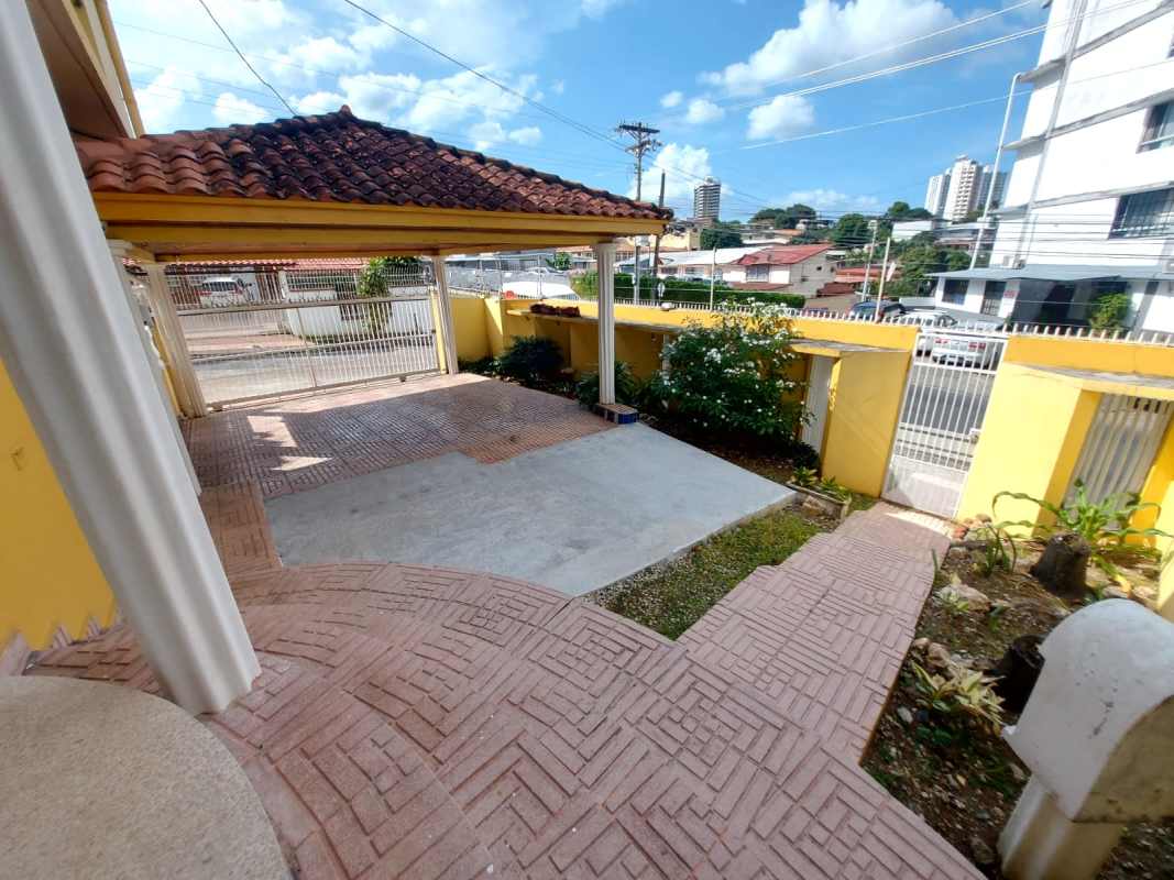 Covered carport with tiled roof, columns and gated entry in Betania Panama City
