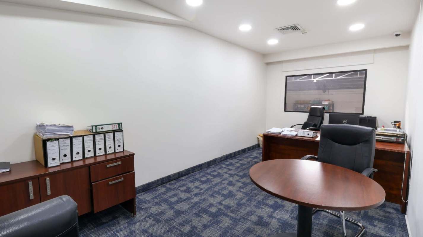 Commercial open space with carpet floors, red doors, large windows Costa del Este Panama