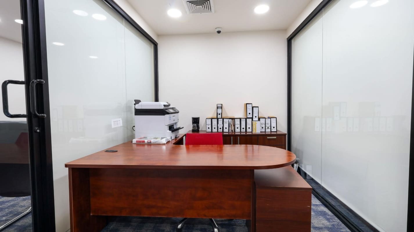 Modern office with spiral staircase to mezzanine glass partition Costa del Este Panama