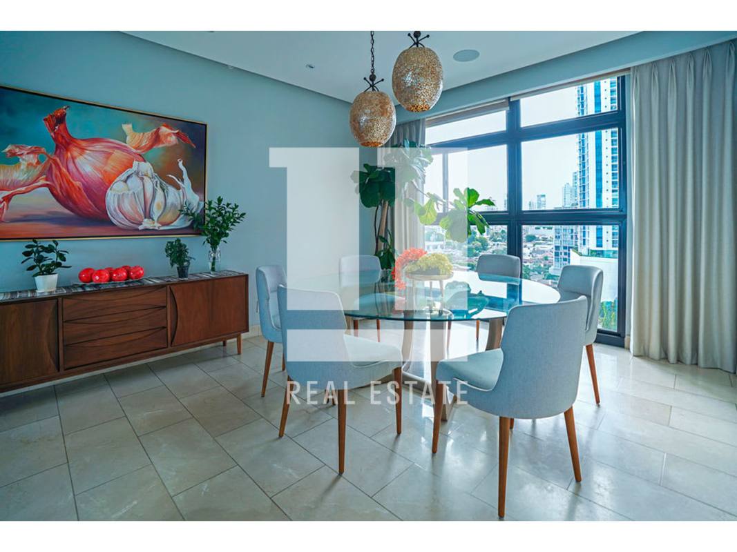 Modern living room with large windows, skyline view, elegant furniture in PH Caleta