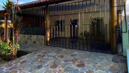 Open living-dining area with wood-look floors and bright window Panama Oeste