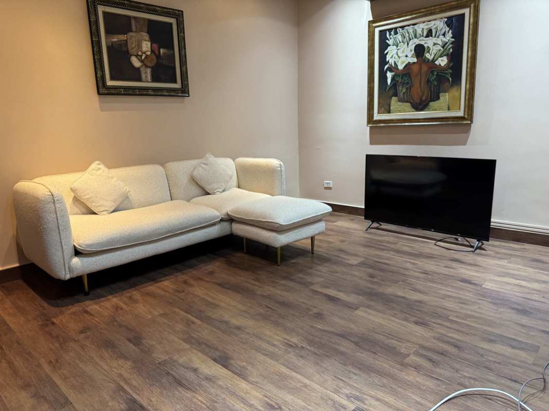 Bright airy living room with large windows, ocean and skyline views at PH Pacific Coast San Francisco Panama