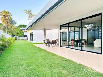 Covered patio terrace and green backyard in La Perla David Chiriquí Panama