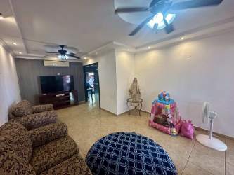 Large kitchen with black cabinets and tiled floors in David Panama house