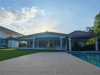 Sunny private swimming pool with gazebo and lounge chairs Coronado Beach Panama