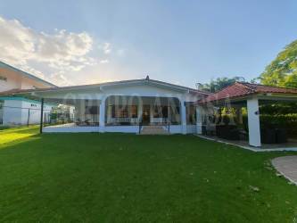 Open plan living room with large windows and modern furnishings Coronado Beach Panama