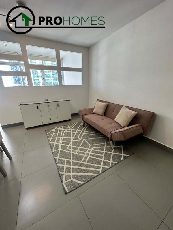 Dining table and furnished living room with ocean view in PH Colores de Bella Vista Panama City