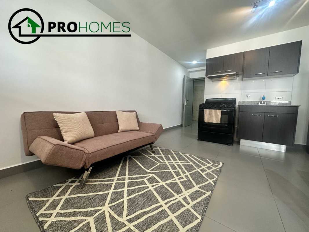 Modern furnished kitchen with appliances granite countertop in PH Colores de Bella Vista Panama City