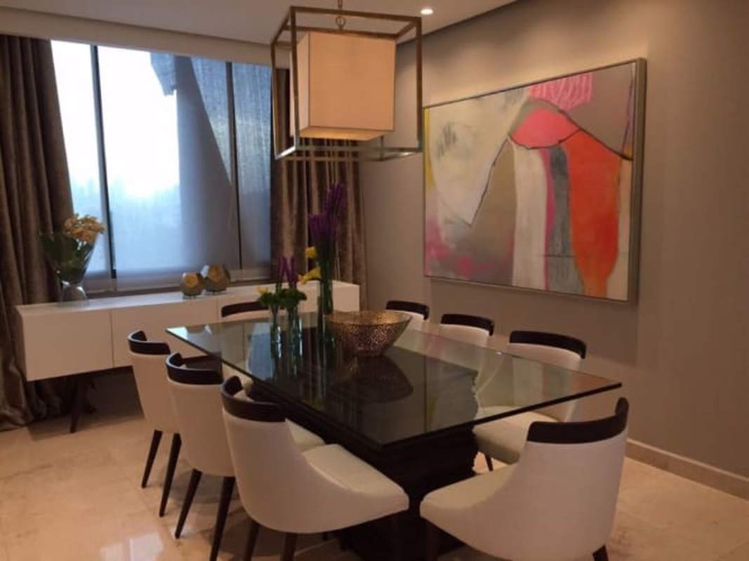 Open living and dining concept with balcony access at PH Dal Mare Coco del Mar Panama