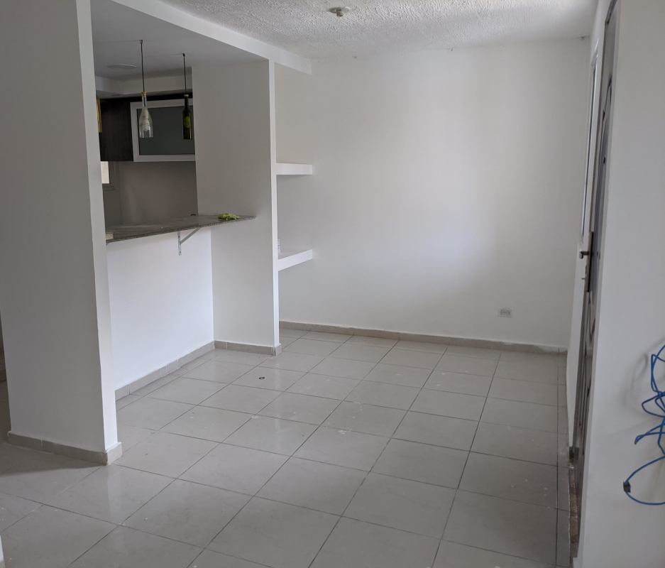 Open plan living dining area with tile flooring in PH Villas del Naranjal Panama