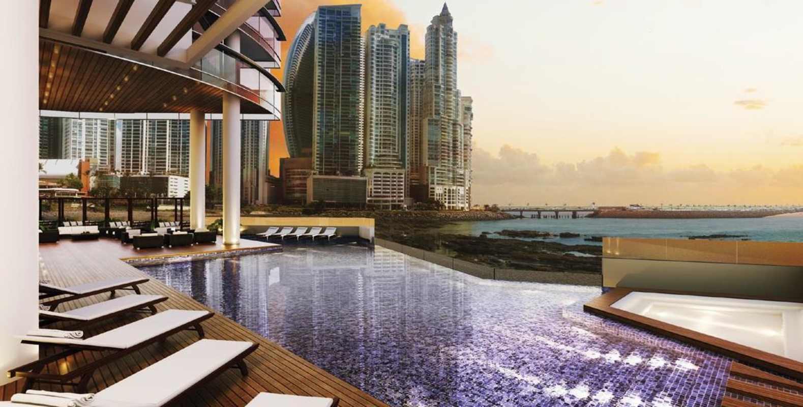 Luxury condo lobby with pool lounge area at PH Sea Point Punta Paitilla Panama
