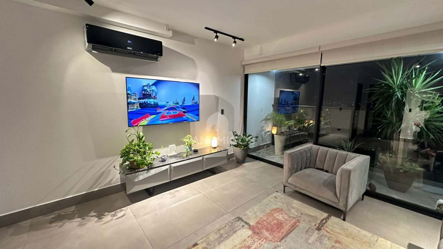 Spacious living room with floor-to-ceiling windows city view in Victory Sport Coco del Mar Panama