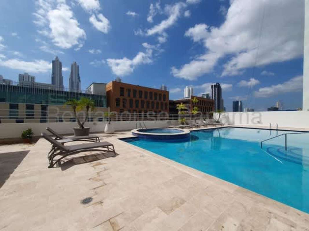 Rooftop infinity pool with jacuzzi and cityscape background in PH LaCosta Costa del Este Panama City