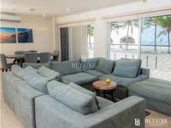 Bright open plan living dining area with balcony access in PH Olas del Mar Playa Caracol Panama
