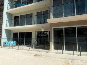 Resort style swimming pools with beachfront loungers at PH Olas del Mar Playa Caracol Panama