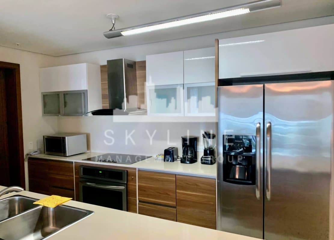 Contemporary kitchen with quartz counters, stainless appliances PH The Regent Costa del Este Panama