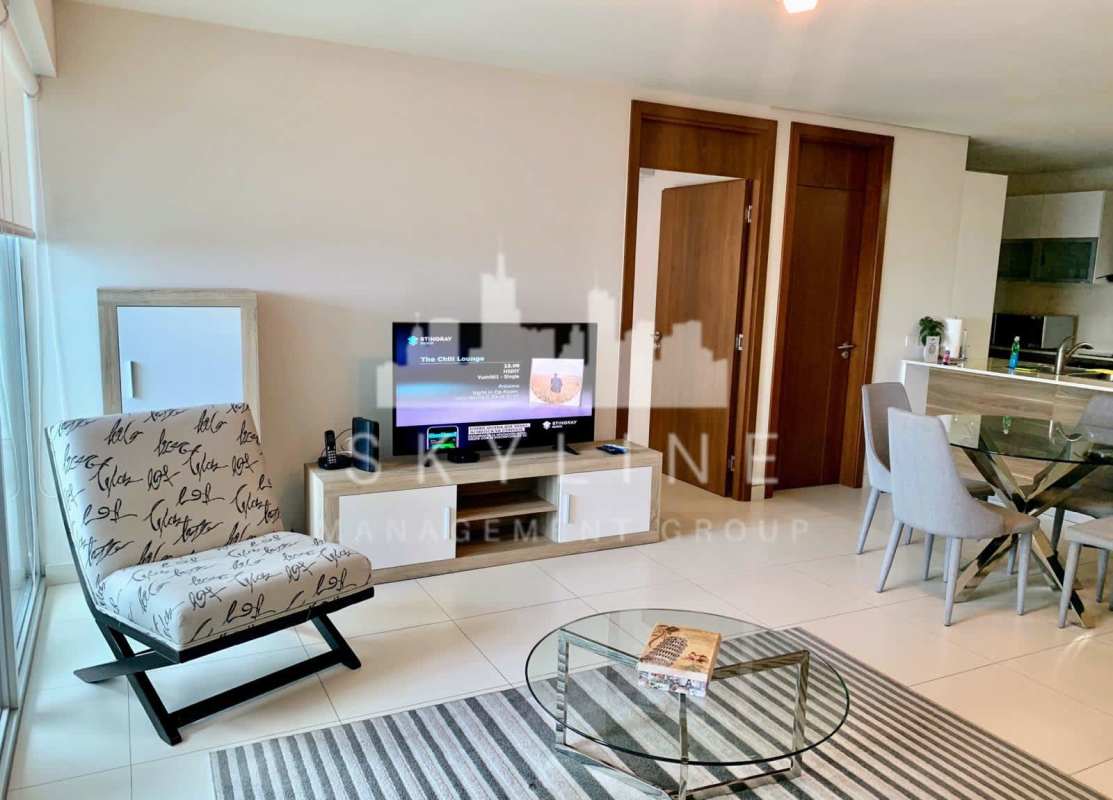 Living area with panoramic windows, modern decor, furnished PH The Regent Costa del Este Panama