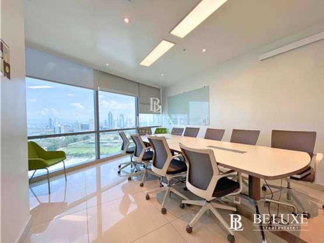 Bright open-plan workspace with large glass windows and modern furnishings in Financial Park Tower Panama
