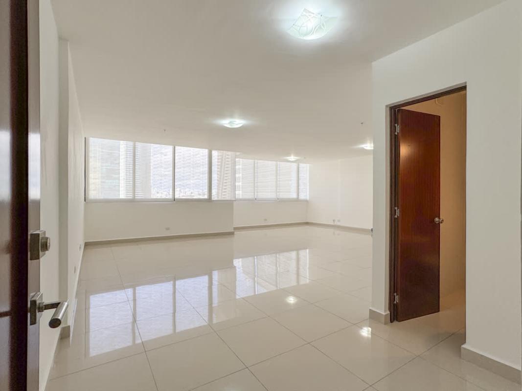 Modern closed kitchen with granite countertops and window view in PH Brisa Marina Panama