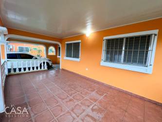 Spacious main bedroom with barn doors wooden finishings in house for sale Los Algarrobos Chiriquí Panama