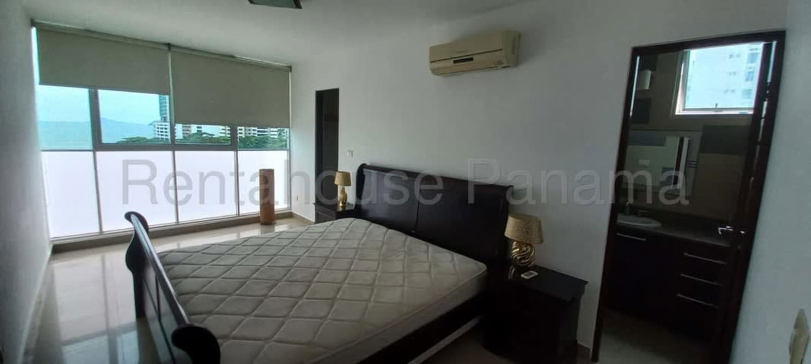 Modern bathroom with granite countertop and glass-enclosed shower at PH Pacific Sea Punta Pacifica Panama City