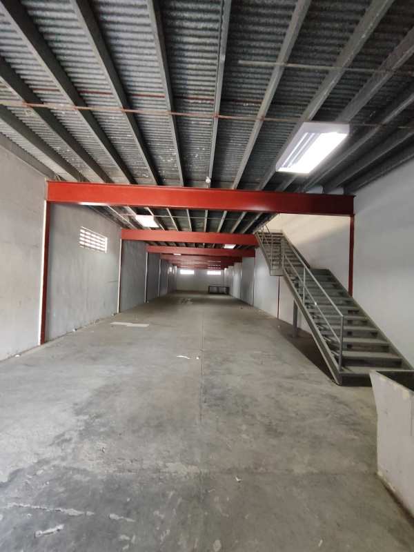 Interior warehouse view featuring mezzanine level with stair access in Juan Díaz Panama