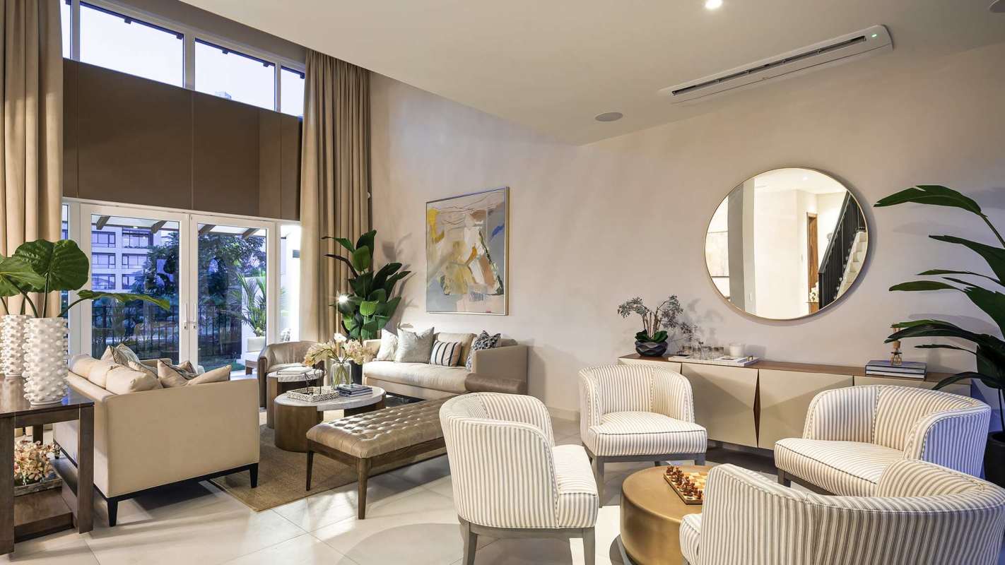 Contemporary living area with neutral decor, large windows Santa María Golf Country Club Panama