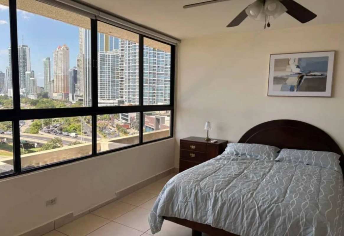 Bedroom area with large windows city view ceiling fan in PH BICSA Panama