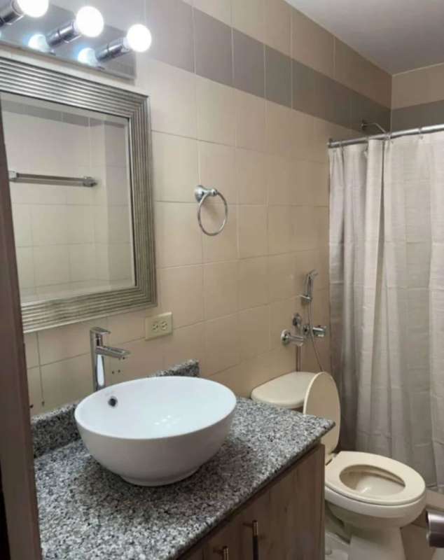 Bedroom with large windows overlooking Panama skyline and Pacific Ocean in PH BICSA tower