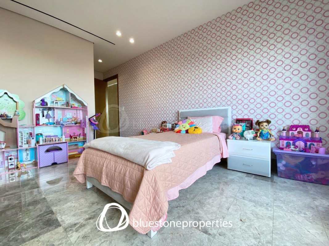 Modern luxury kitchen fully equipped with central marble island and top appliances with golf view