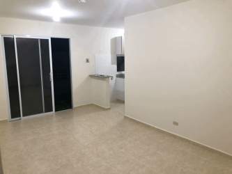 Living room space with sliding glass door to garden area rental house La Arboleda Los Avellanos La Chorrera Panama