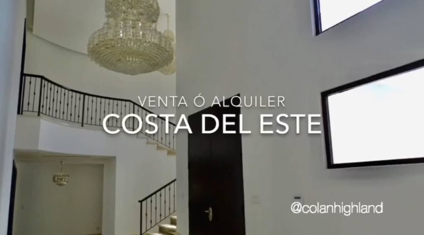 Spacious double height foyer with chandelier and staircase in luxury Costa del Este home Panama