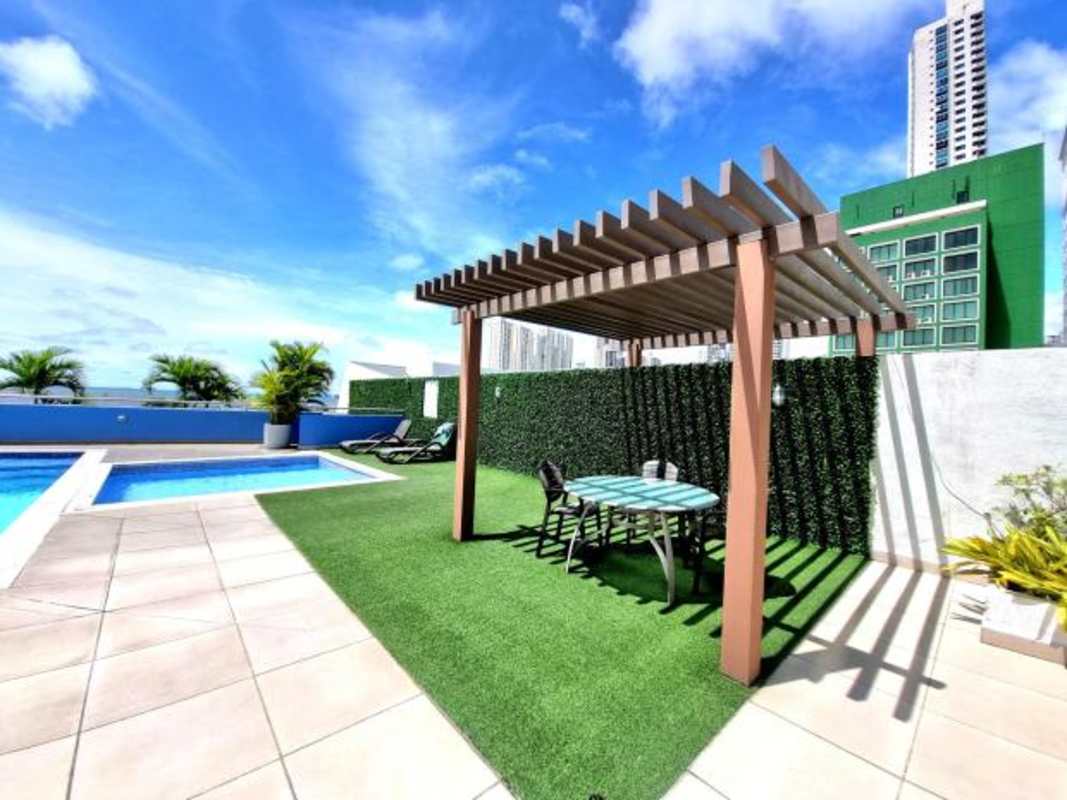Elegant bathroom with double sink granite countertop and glass shower at PH Cabomarzo Panama
