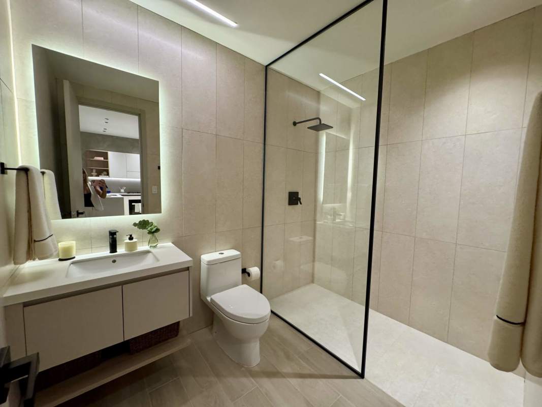 Contemporary bathroom with marble floors and glass shower in Costa del Este PH Ipanema