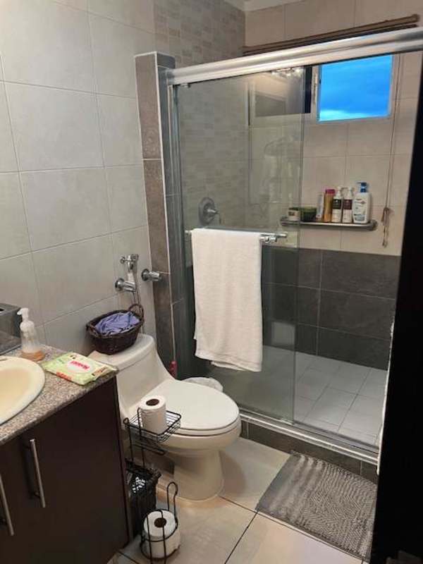 Bathroom with glass shower enclosure, granite vanity in PH Dos Mares Panama City