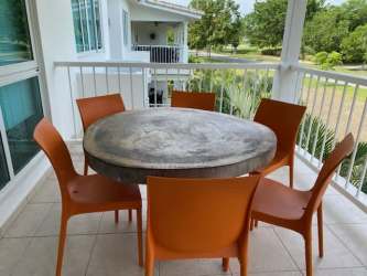 Private balcony with BBQ grill, dining table, golf course view at Bijao resort Panama