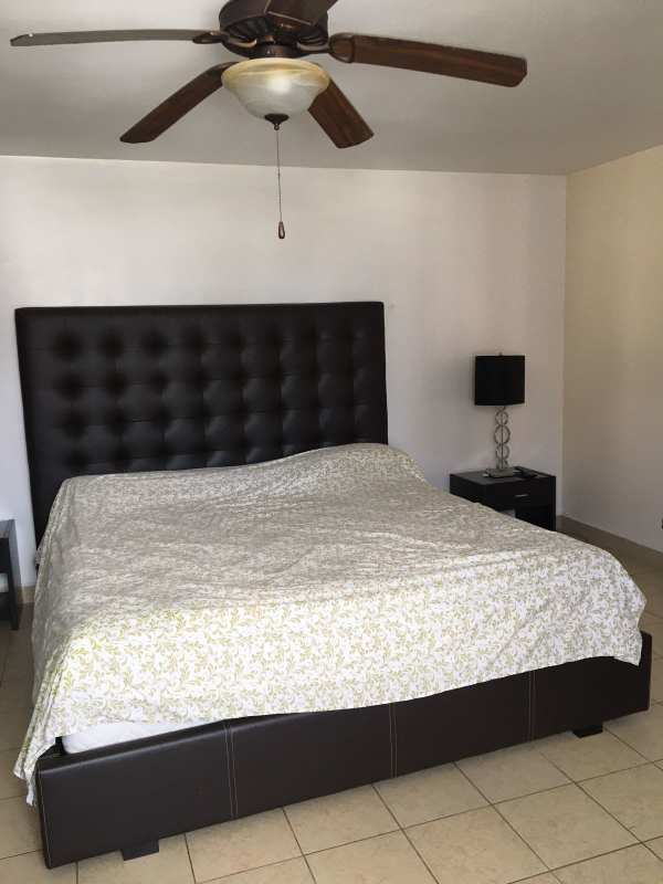 Traditional kitchen with granite countertop, wooden cabinets, stainless appliances in PH Don Camilo Panama City