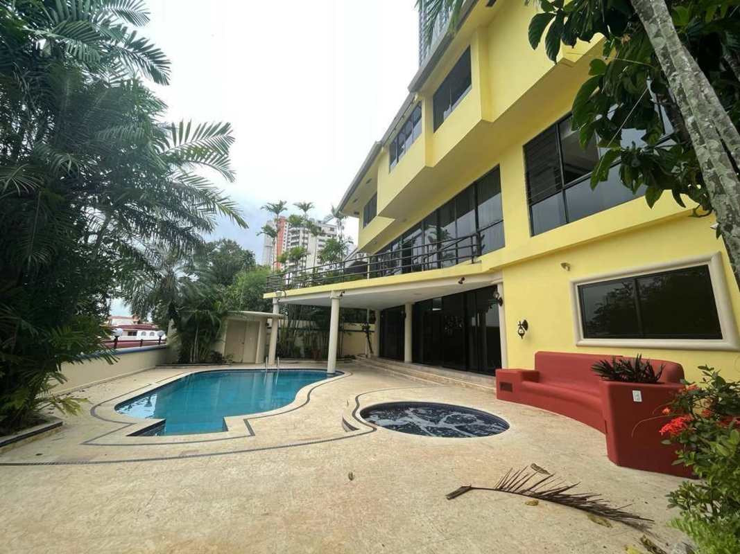Formal dining room with elegant columns and marble floor in Dos Mares luxury home Panama