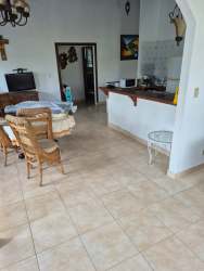 Dining and living area with natural light tiled floors perfect for group beach rental Panama
