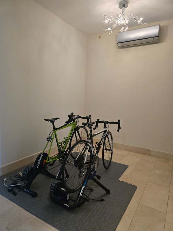 Large covered balcony with panoramic views of golf course and city skyline at Santa Maria