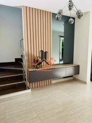 Modern bedroom with natural light, wardrobe, gray bedding Howard Capira Panama