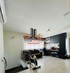 Bright living room with entertainment center, large window and stairway Howard Capira Panama