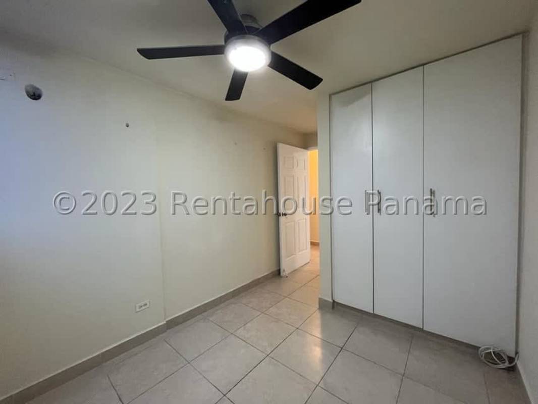 Kitchen area featuring granite countertops, dark cabinets and tiled floors in PH Splendor Panama City