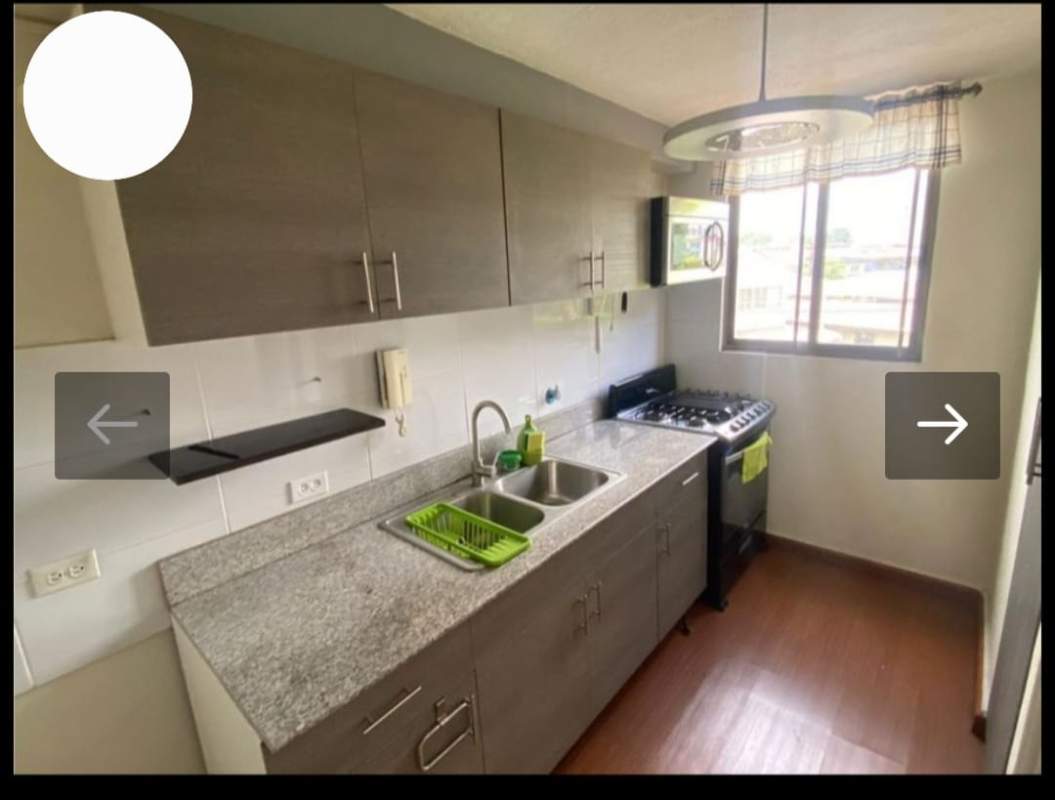 Compact modern kitchen with cabinets, granite-style countertops at PH Chanis Gardens Panama City