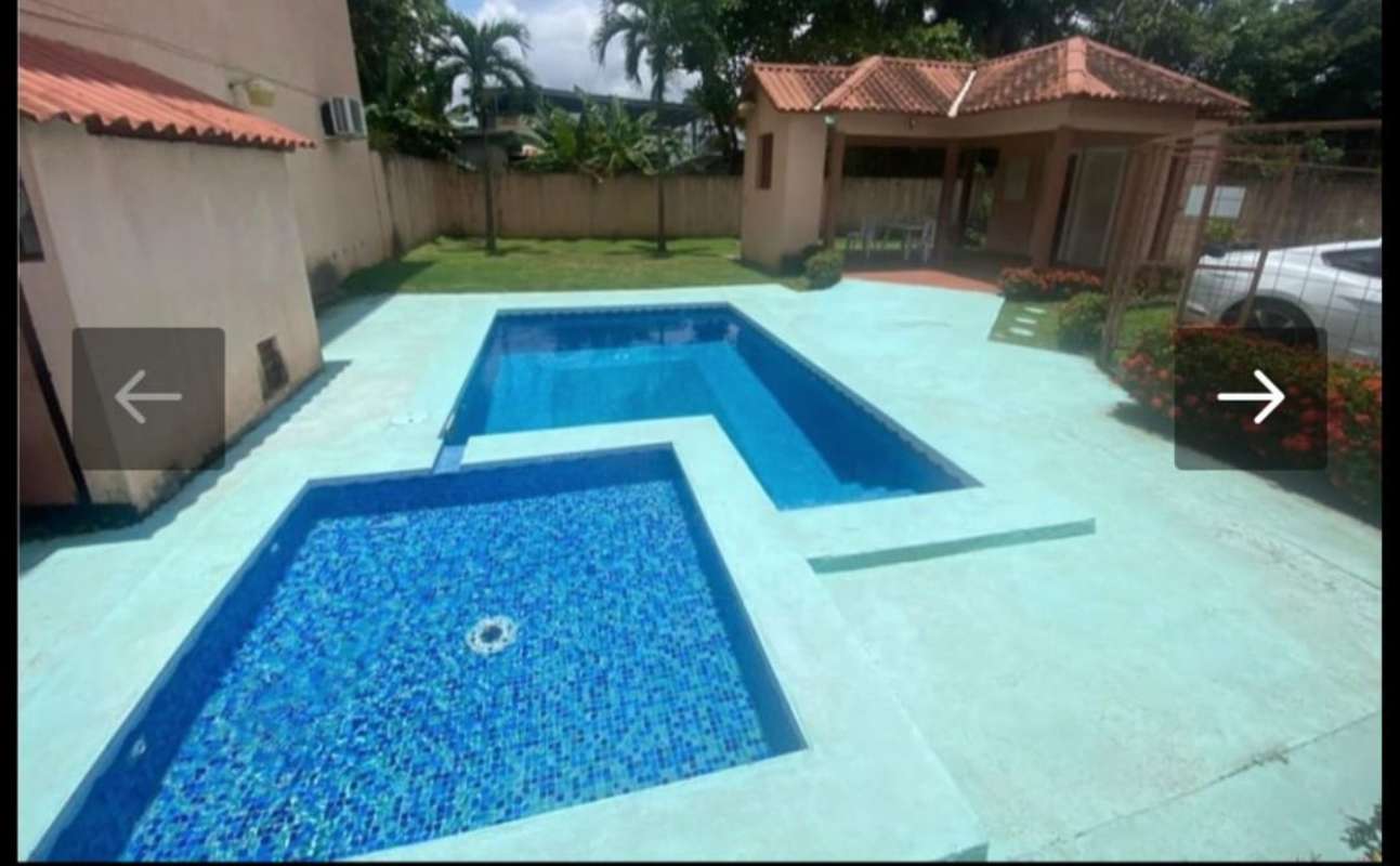Swimming pool with garden and social lounge area in PH Chanis Gardens apartment complex Chanis Panama